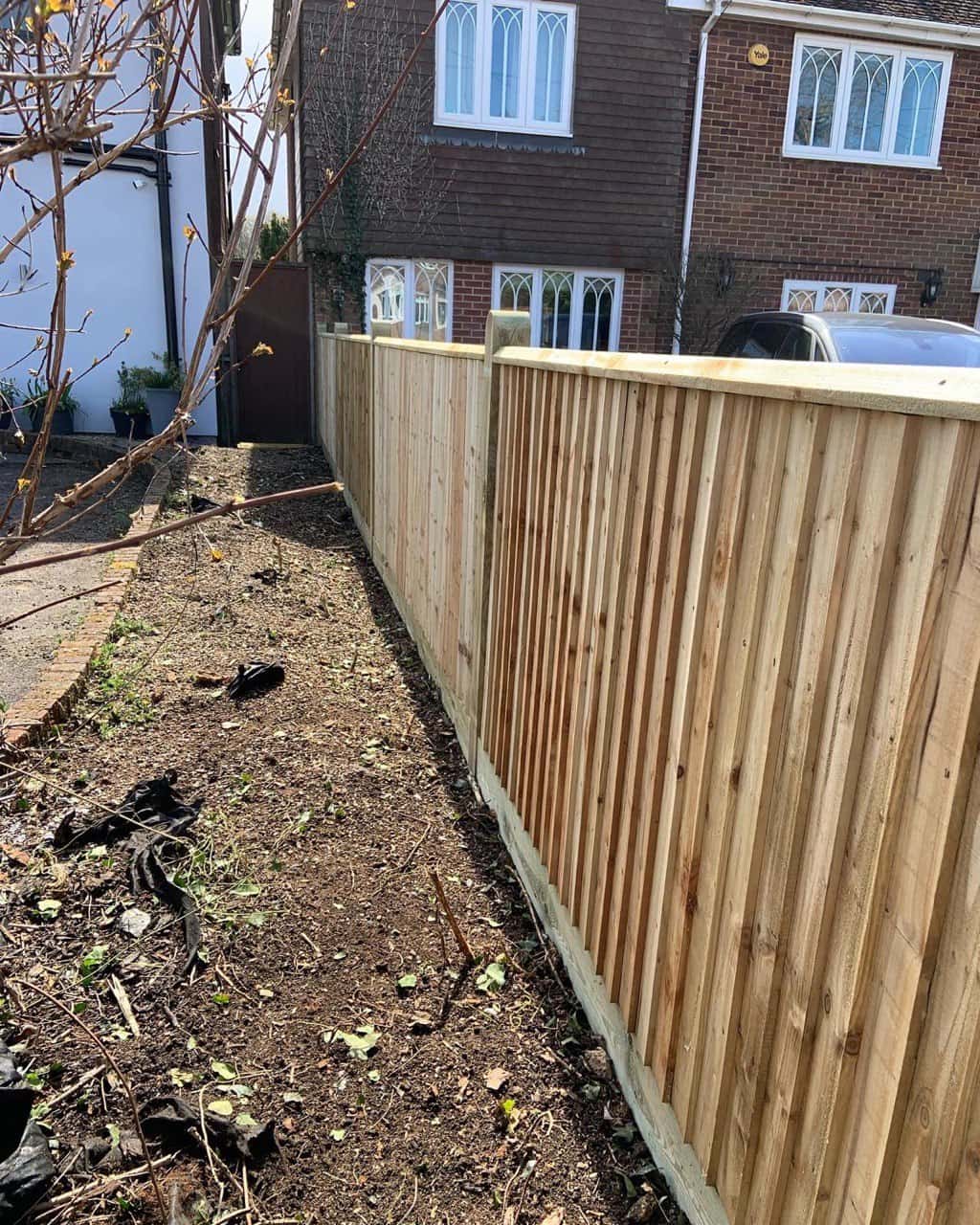 This is a photo of feather edge fencing installed in a residential property by Fast Fix Fencing Oxted